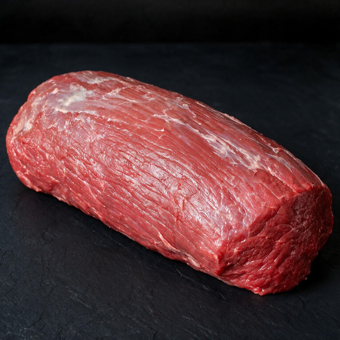 Black Angus Eye Round halal UK supplier on dark slate