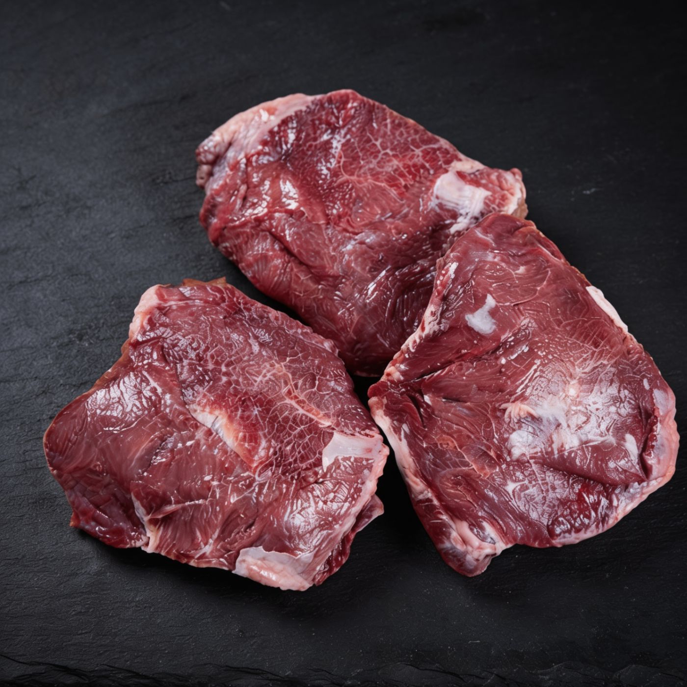 Black Angus Beef Cheeks halal UK supplier on dark slate